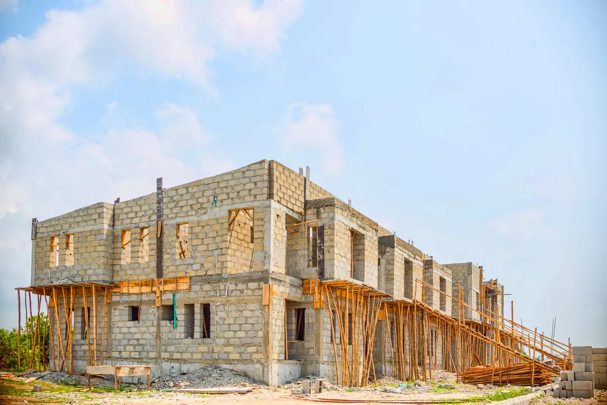 Concrete building frame under construction with scaffolding